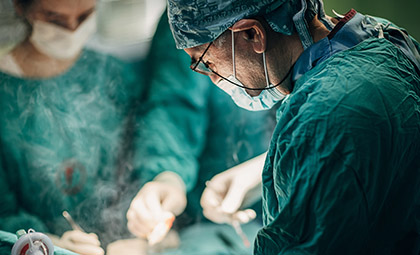 dr. saeid aryan performing spine surgery